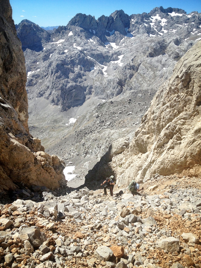 Climbing scree during the ascent of Pena Vieja